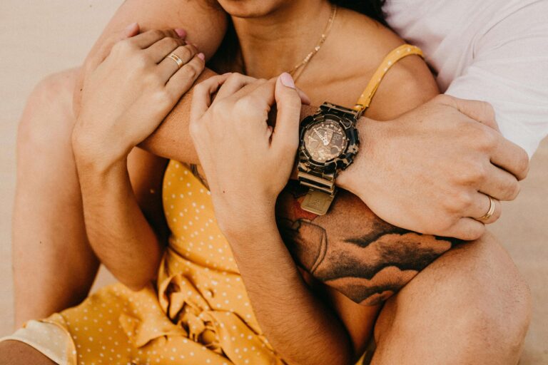 Man wrapping his arm around a woman to embrace her. Learn the difference between communication and intimacy to untangle old knots to create real connection with relationship therapy in Los Angeles, CA.