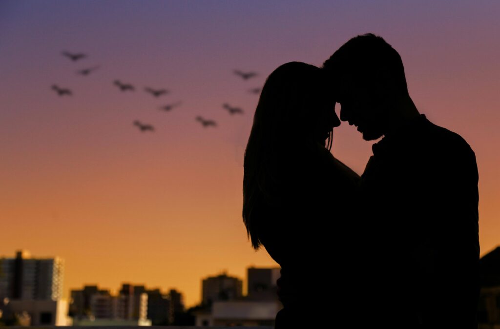 Couple embracing as the sun sets. Begin to rebuild connection with your self and your relationships in healthy ways with relationship therapy in Los Angeles, CA.