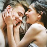 Vulnerability Is Strength: Why Showing Your True Self Is the Ultimate Power A couple lying close together, smiling and touching each other’s faces while sharing an intimate, tender moment. Learn how relationship therapy in Los Angeles, CA helps you open up emotionally and build deeper connection with the guidance of a skilled relationship therapist.