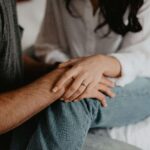 When Connection Feels Hard: Rebuilding Closeness Through Relationship Therapy in Los Angeles, CA Close-up of couple's hands gently holding each other with engagement ring visible. Repair hurt and strengthen your connection through relationship therapy in Los Angeles, CA.